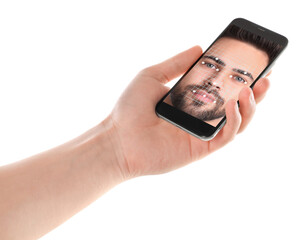 Man using smartphone with facial recognition system on white background, closeup. Biometric...