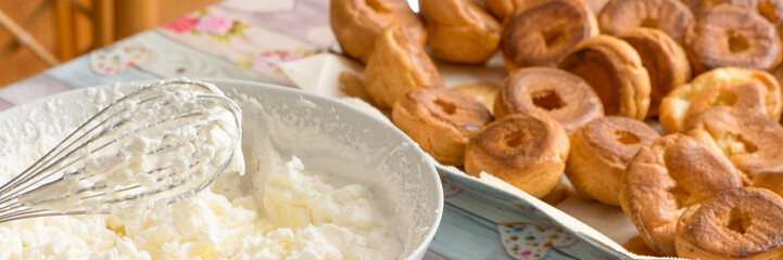  kitchen table preparation of pastry filled with cream