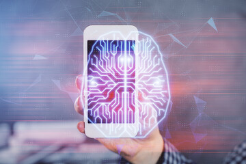 Double exposure of man's hand holding and using a digital device and brain hologram drawing. Data concept.