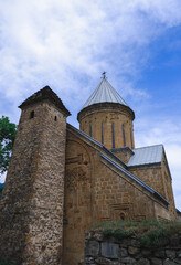 Fototapeta premium Fortress in Georgia on the shore of the Ginval reservoir. Old Orthodox church. Ananuri Fortress