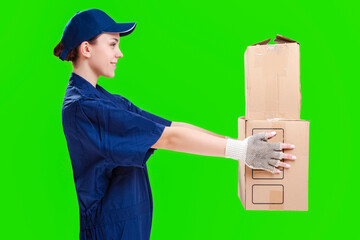 Delivery and Shipment Ideas. Positive Caucasian Female Courier On Delivery with Carton Boxes. Offering Freight to Addressee.  Against Green Background.