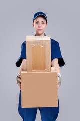 Delivery Services Ideas. Portrait of Positive Caucasian Female Messenger With Variety Disptatched...
