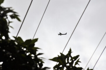 propeller plane flying around the neighbourhood practicing in the morning. 