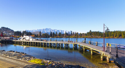 Fototapeta na wymiar Beautiful Landscape of Lake Wakatipu Queenstown New Zealand; Queenstown City, South Island; Wooden Pier 