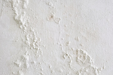 Wall showing peeling and bubbling paint due to water leak behind wall.