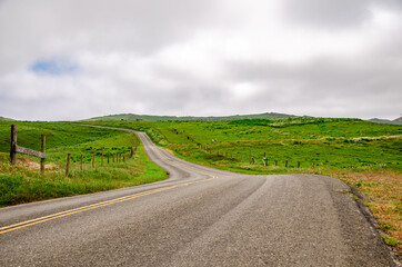 View of the scenic road and green meadows
