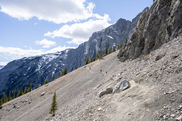 Descent on the scree while hiking in Canadian Rockies, shot at Mt Yamnuska trail, Alberta, Canada