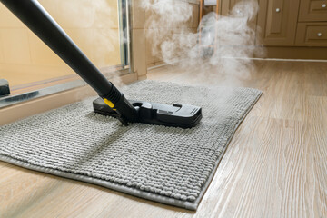 Cleaning bathroom mat using steam cleaner - 357098229