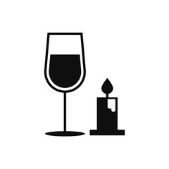 glass of wine with candle
