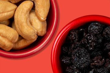 jars with fresh food with cashews and another with raisins