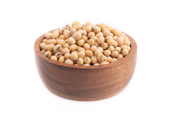 Soybean seeds in a wooden bowl, isolated on white background