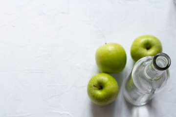Wet fresh green apples on a table. The concept of organic and healthy food