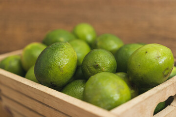 fresh limes in a box