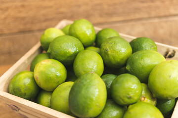 limes on a wooden table