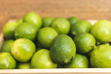 fresh limes on a wooden table