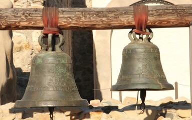 Obraz premium Two antique small and big bells.