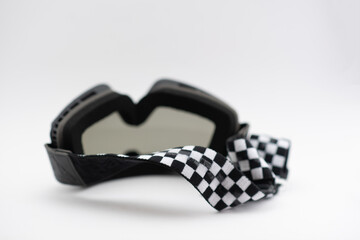 A pair of used motorcycle motocross goggles isolated on white