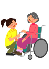 車いすの女性と介護スタッフ