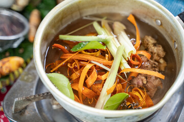 ginger, lemongrass, lime leaf and shaved wood shavings boiled in a pan, the raw material of jamu empon-empon