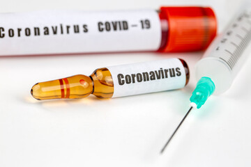 Vaccine concept for new Corona Virus Outbreak from China, Wuhan. Immunisation Vaccination for Pandemic Coronavirus in Medical Bottle storage and medical Syringe.