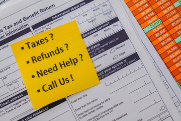 Sticky note on Canadian Tax Forms ot advertise Tax services