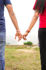 couple holding hands at nandi hills banglore 
