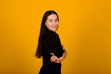 Obraz premium Wow. Beautiful female front portrait isolated on yellow studio backgroud. Young emotional surprised woman standing with open mouth. Human emotions, facial expression concept.