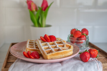 Sweet crispy waffles with strawberries 