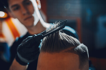 Man with a beard. Hairdresser with a client.