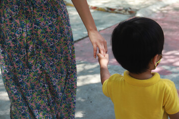 Mother and child shake hands