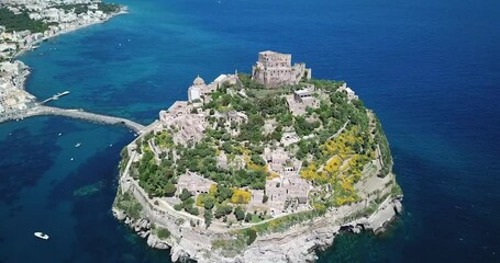 Aerial view of the whole Aragonese castle on the island Ischia, Italy. View from the top to the hill and the sea.