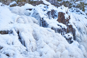Icy waterfall on a mountain river.