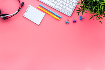 Education online school concept. Stationery, keyboard on pink table top view flat lay copy space