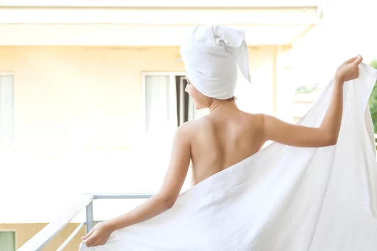 Premium Photo  Back view woman with bare back and towel on white