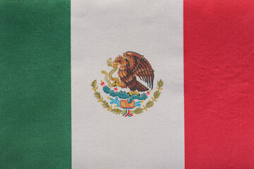 National emblem of Mexico close up. Tricolor green, white, red and coat of arms
