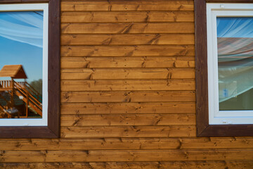 Wooden wall. The texture of the timber. Brown nature background. High quality photo