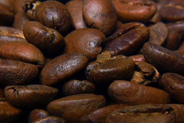 photo of freshly roasted coffee beans and left to cool before packaging, roasted to medium roast level so that they have a mild taste for coffee lovers who like light coffee