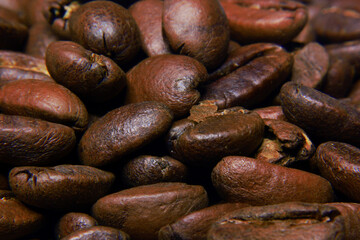 photo of freshly roasted coffee beans and left to cool before packaging, roasted to medium roast level so that they have a mild taste for coffee lovers who like light coffee