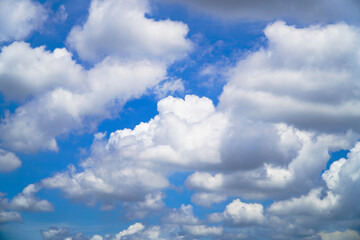 Naklejka na ściany i meble White clouds cumulus floating on blue sky for backgrounds concept 