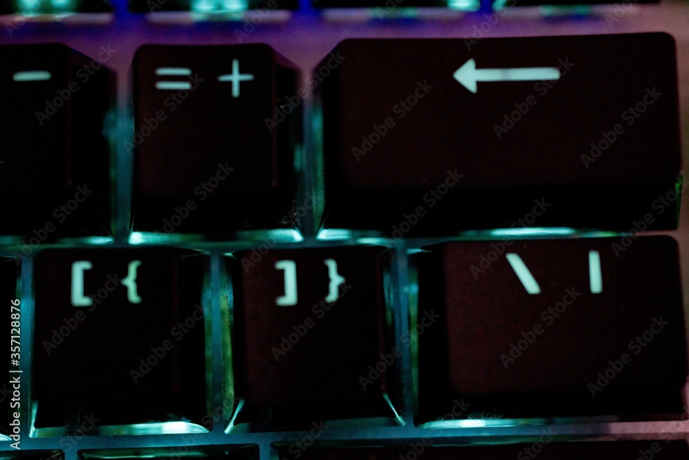 Poster closeup shot of an illuminated computer keyboard
