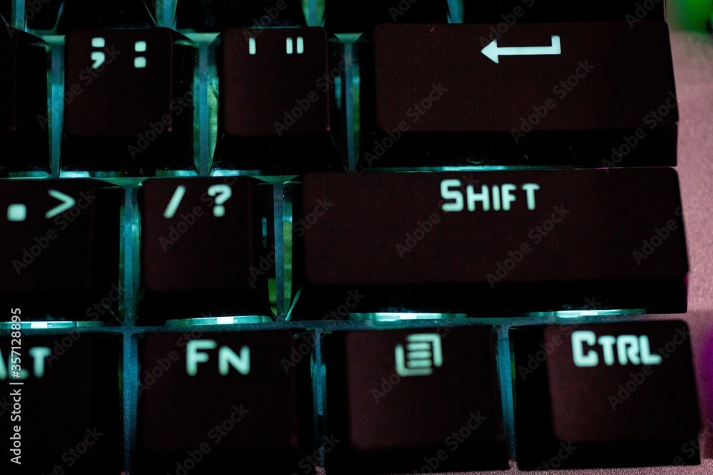 Poster closeup shot of an illuminated computer keyboard