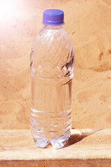 Water bottle on the sand