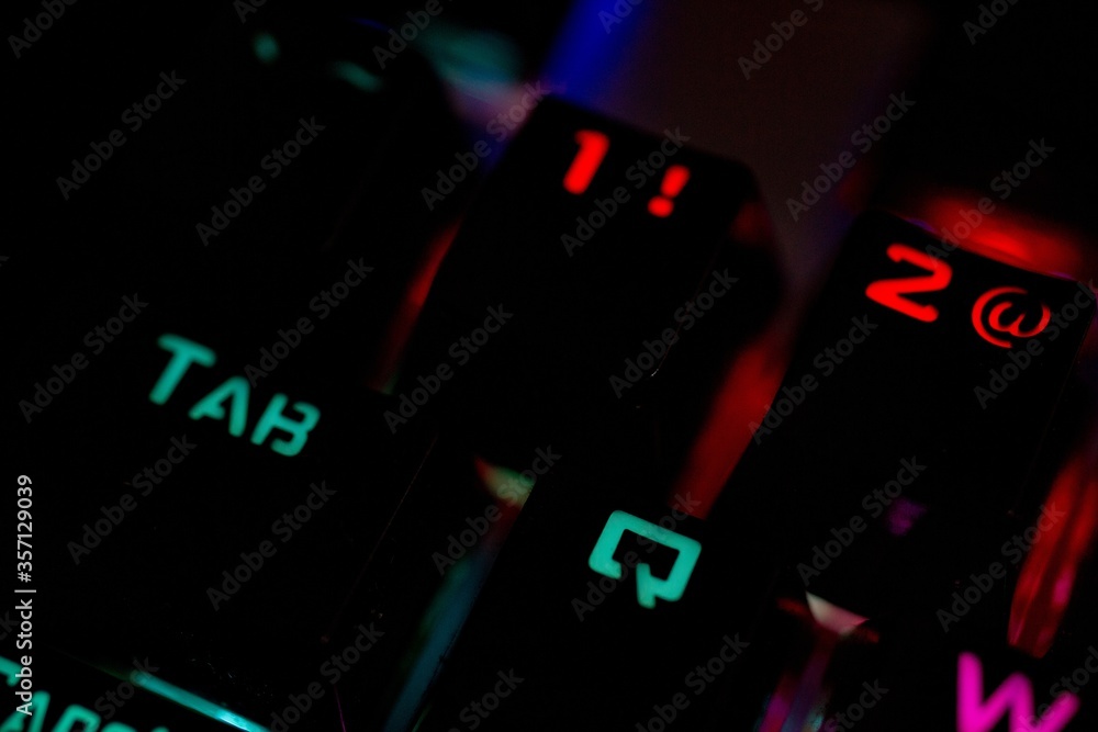 Poster closeup shot of an illuminated computer keyboard