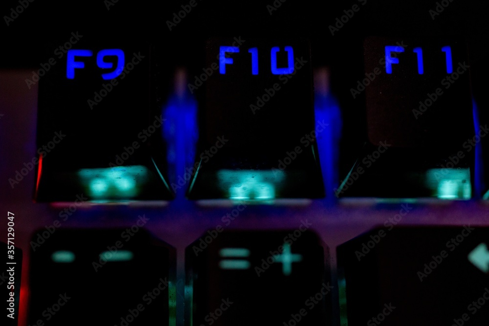 Poster closeup shot of an illuminated computer keyboard