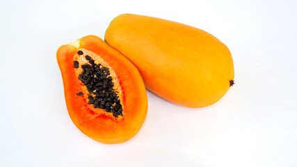Papaya in half cut and and whole papaya in white background. topical fruit.