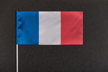 National flag of France on black background. Tri-color flag: blue white red