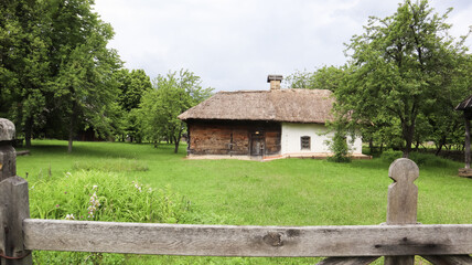 Fototapeta na wymiar Ukraine, Kiev - June 11, 2020. The old house of peasants in the museum Pirogovo. National Museum of Folk Architecture and Everyday Life of Traditional Folklore Houses of Different Regions of Ukraine