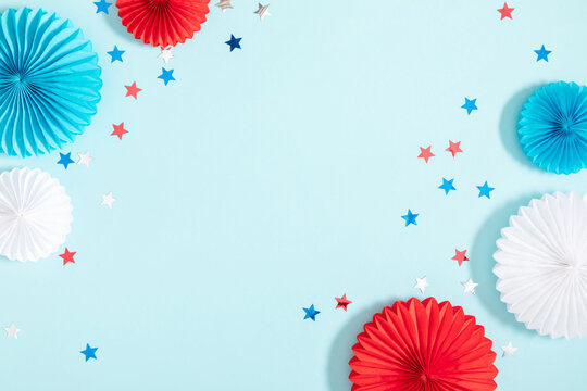 4th of July American Independence Day. Happy Independence Day. Red, blue and white star confetti, paper decorations on blue background. Flat lay, top view, copy space