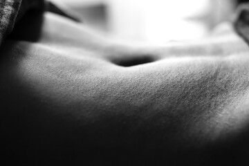 Close shot of female navel black and white