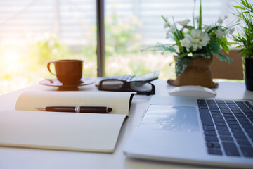 top viweAccounting equipment is placed on the desk in the house to reduce meeting people according to work-at-home measures.